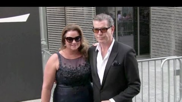 'Lenny Kravitz, Pierce Brosnan and his wife Keely attending the YSL Men Fashion Show'