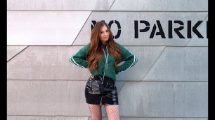 'GREEN HOODY, VARNISH SKIRT, FISHNET TIGHTS & BIKER BOOTS'